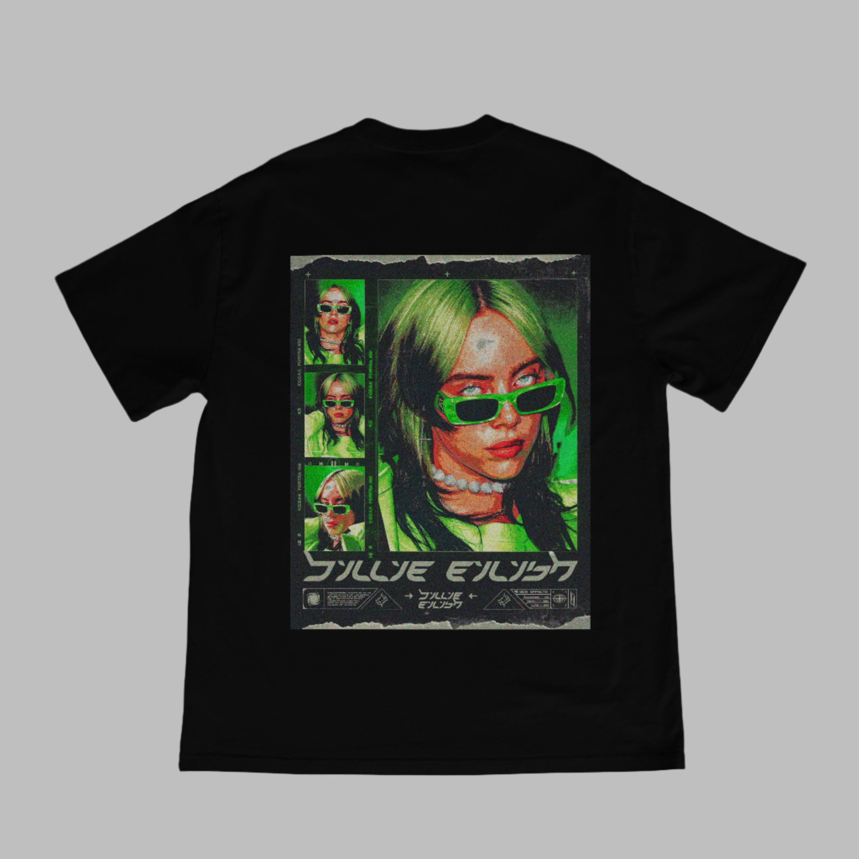Black t-shirt with a graphic design of a person with green hair and sunglasses on a beige surface